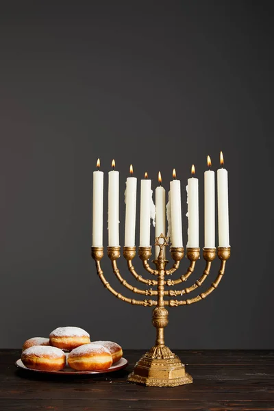 Delicious Doughnuts Burning Candles Menorah Wooden Table Hanukkah Isolated Grey — Stock Photo, Image