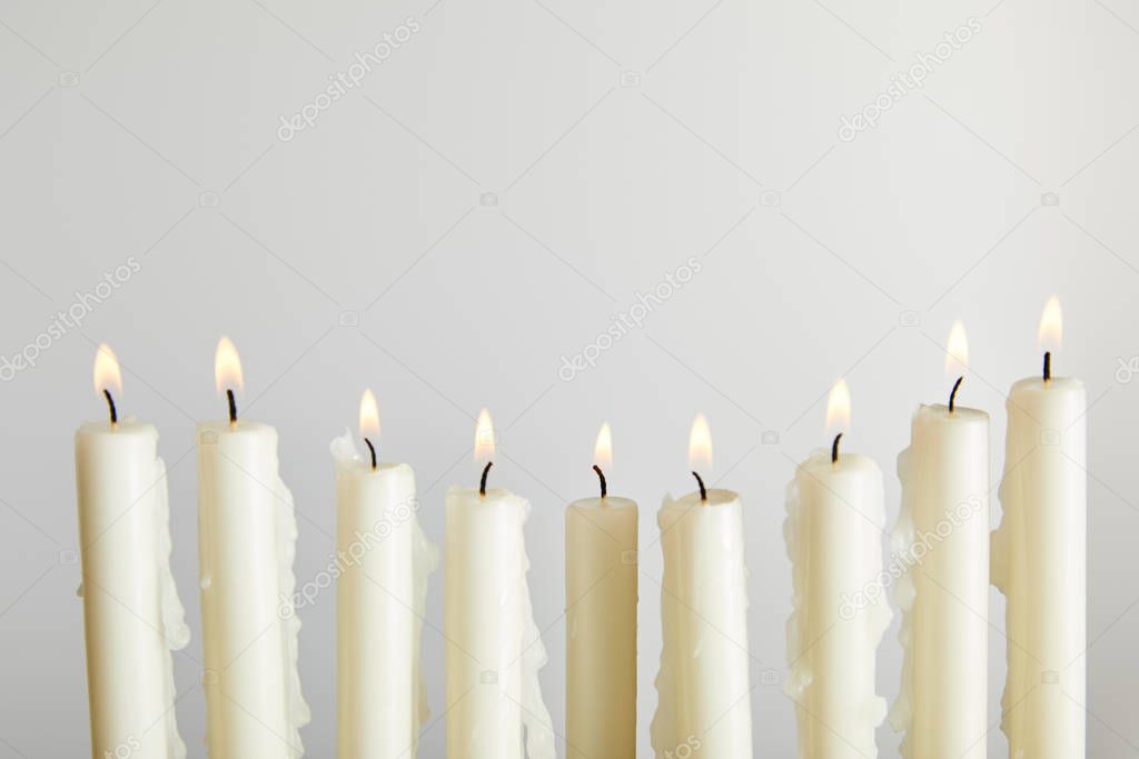 burning candles isolated on white