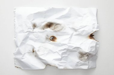 top view of empty crumpled and burnt vintage paper on white background clipart