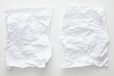 top view of empty crumpled paper sheets on white background clipart