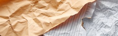 top view of empty crumpled and burnt vintage papers, panoramic shot clipart
