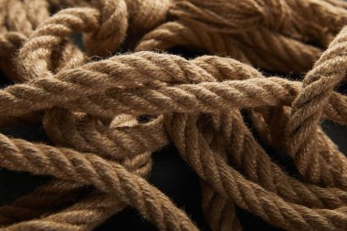 close up view of rope on black background clipart