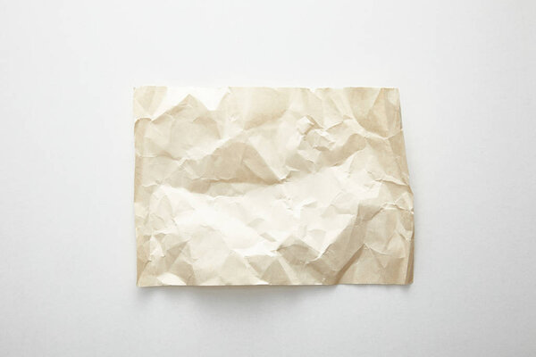 top view of empty crumpled vintage paper on white background