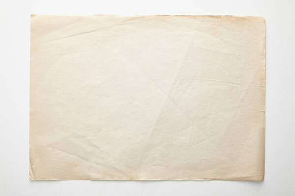 top view of empty vintage paper on white background