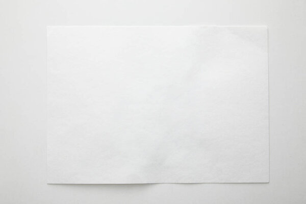 top view of empty paper on white background