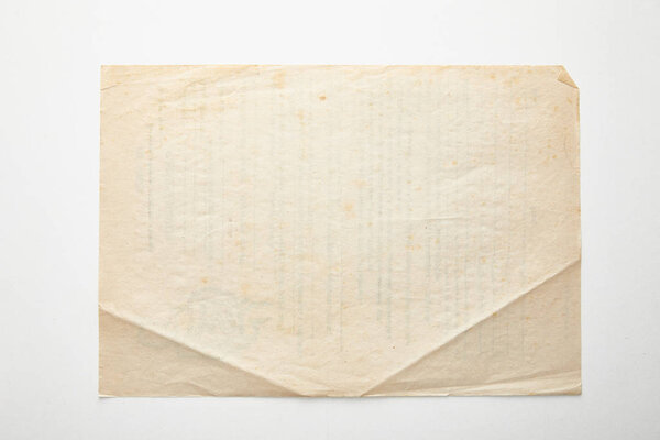 top view of empty vintage paper on white background