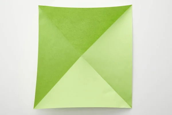 Widok Góry Pusty Zielony Origami Papier Białym Tle — Zdjęcie stockowe