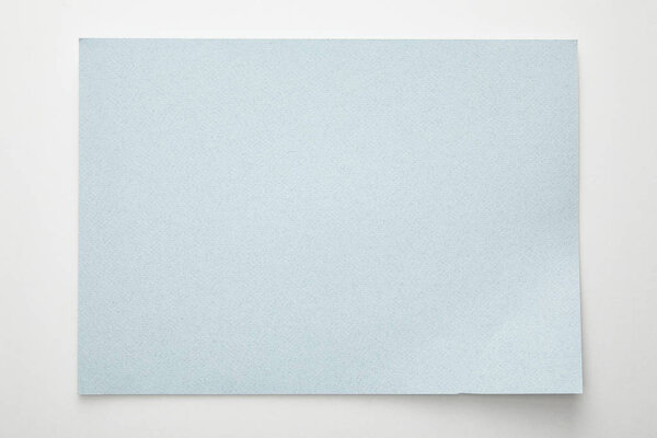 top view of empty blue paper on white background