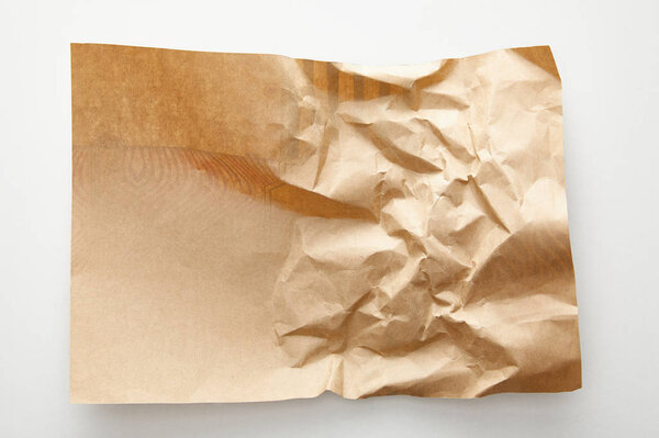 top view of empty crumpled craft paper on white background