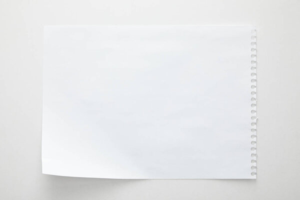 top view of empty paper sheet on white background