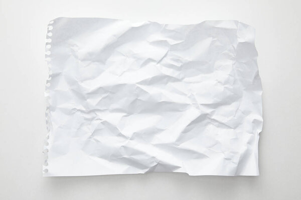 top view of empty crumpled paper on white background