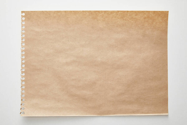 top view of empty craft paper on white background