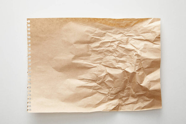 top view of empty crumpled craft paper on white background