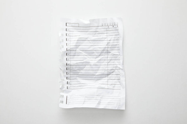 top view of empty crumpled paper on white