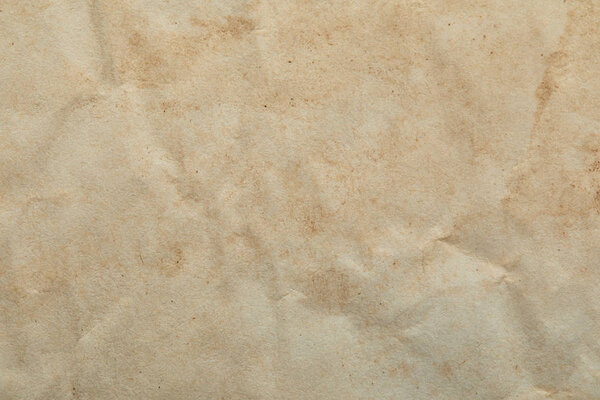 top view of crumpled vintage beige paper texture with copy space