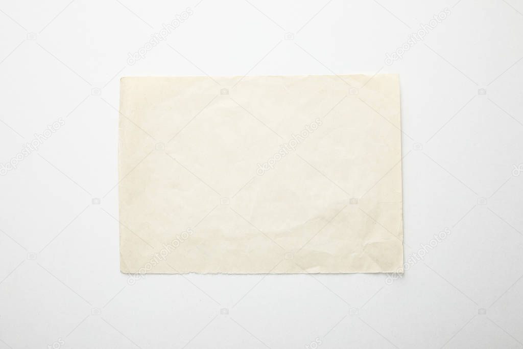 top view of empty vintage paper on white background