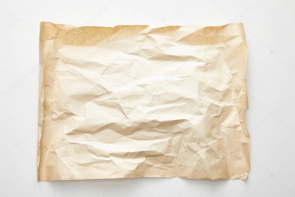 top view of empty crumpled vintage paper on white background