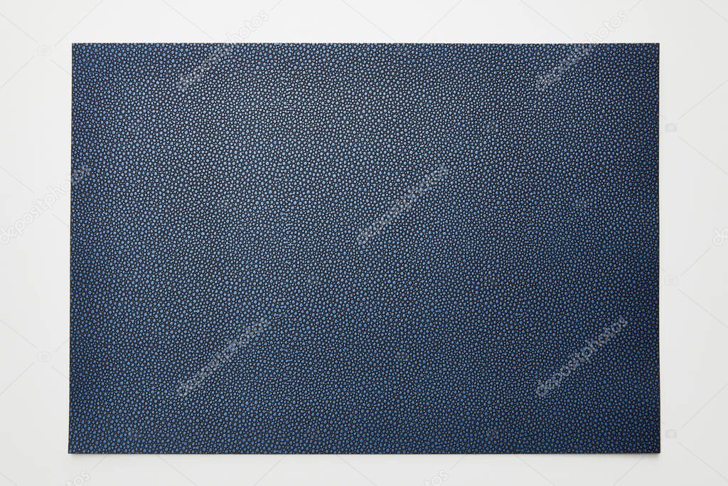 top view of empty dotted blue paper on white background