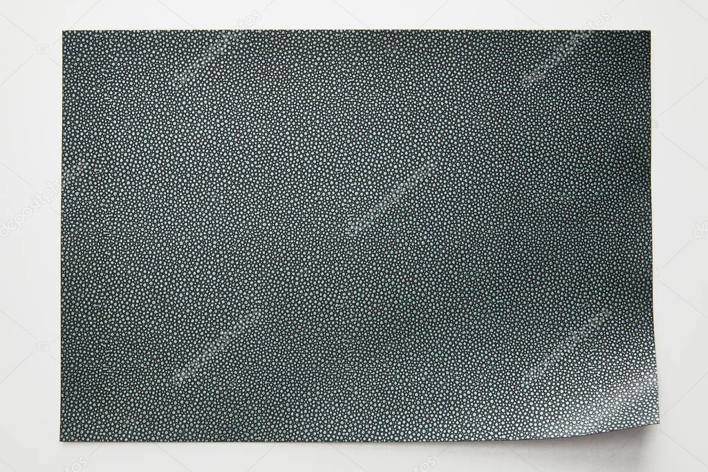 top view of empty dotted grey paper on white background