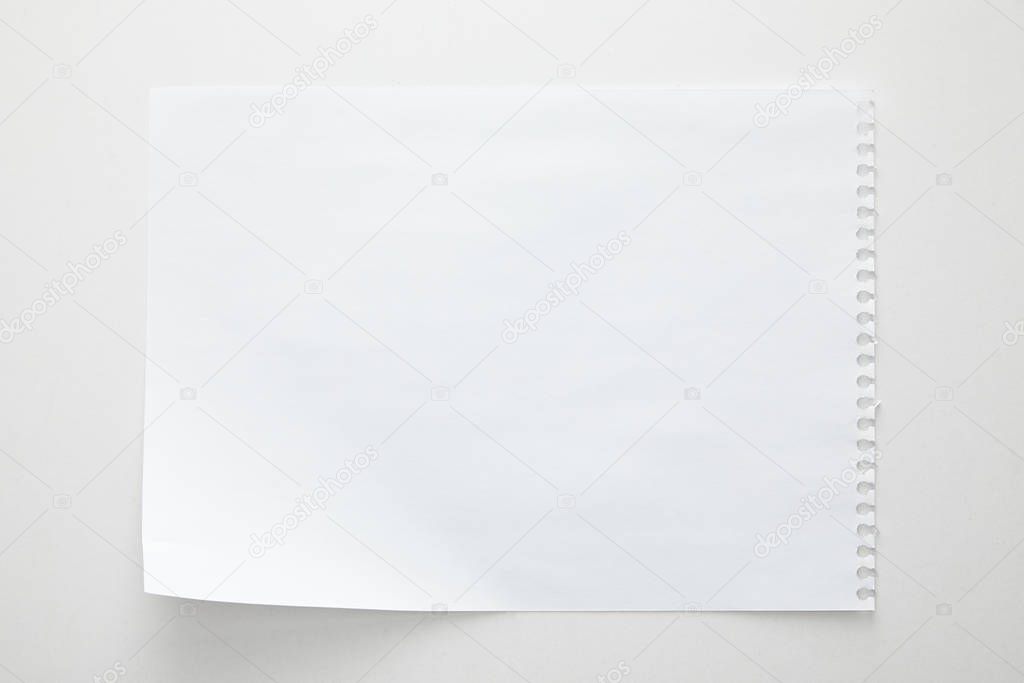top view of empty paper sheet on white background