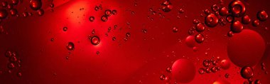panoramic shot of creative red color background from mixed water and oil bubbles clipart