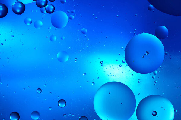 Beautiful color abstract background from mixed water and oil in blue color