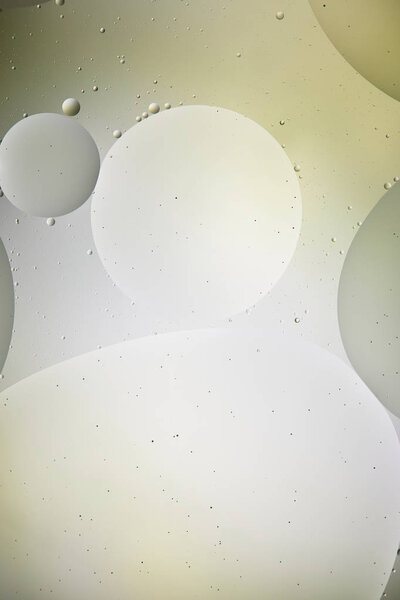 light green and grey color background from mixed water and oil bubbles 