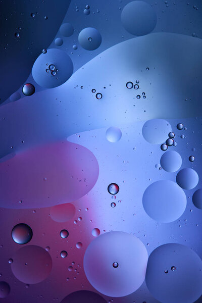 blue and purple color abstract background from mixed water and oil 