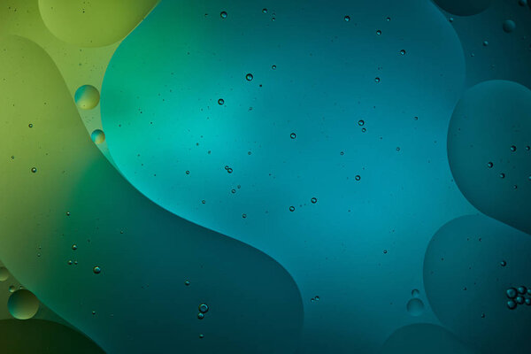 Beautiful abstract background from mixed water and oil in turquoise color