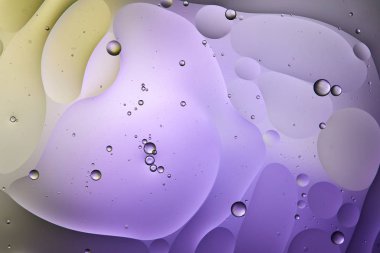 Beautiful purple and green color abstract background from mixed water and oil clipart