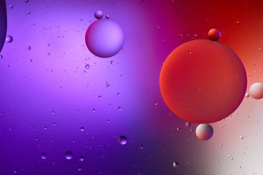 abstract purple and red color texture from mixed water and oil bubbles clipart