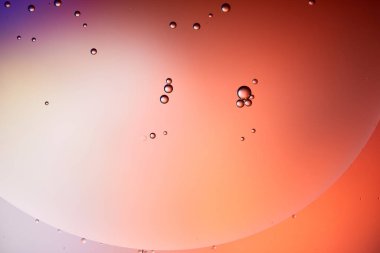 abstract background from mixed water and oil bubbles in red color clipart