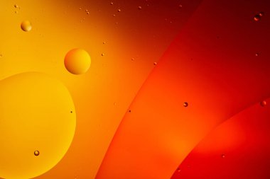 abstract orange and red color background from mixed water and oil  clipart