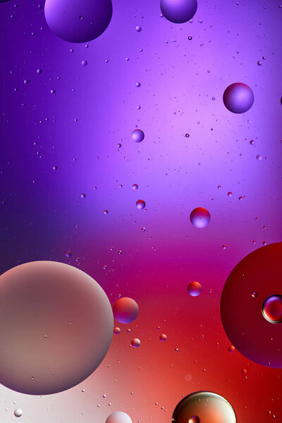 creative abstract purple and red color texture from mixed water and oil bubbles