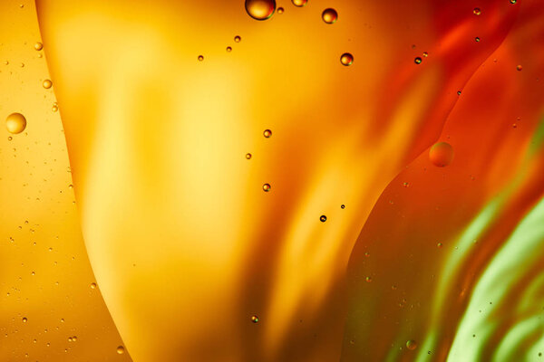 abstract orange, red and green color background from mixed water and oil 