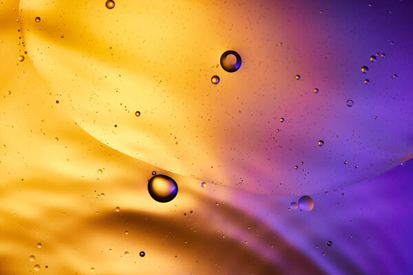 abstract orange and purple color background from mixed water and oil 