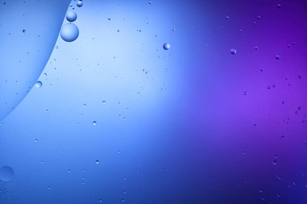 Beautiful abstract blue and purple color background from mixed water and oil 