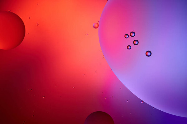 pink and purple color abstract background from mixed water and oil bubbles 