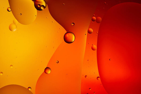 abstract macro orange and red color background from mixed water and oil 
