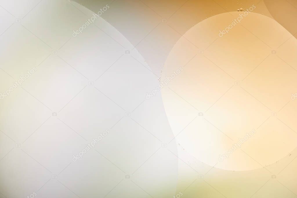 Beautiful abstract background from mixed water and oil in orange and grey color