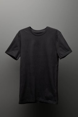 blank basic black t-shirt on grey background clipart