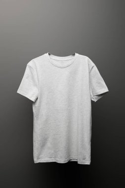 blank basic light grey t-shirt on grey background clipart