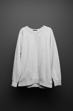 blank basic grey sweatshirt on black background clipart
