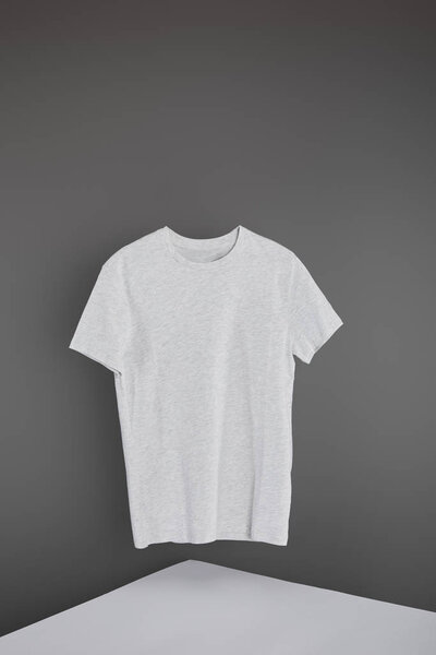 blank basic light grey t-shirt on grey background