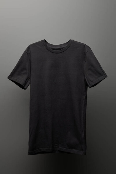 blank basic black t-shirt on grey background