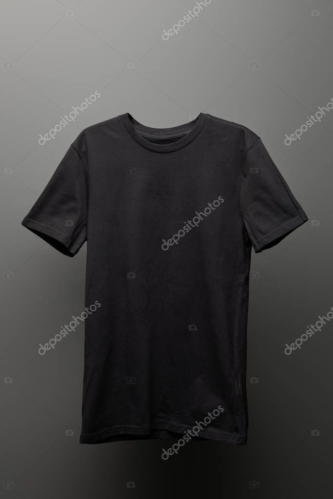 Blank basic black t-shirt on grey background