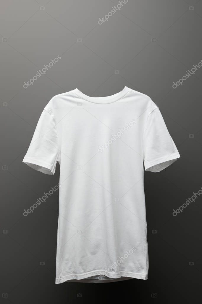 Blank basic white t-shirt on grey background
