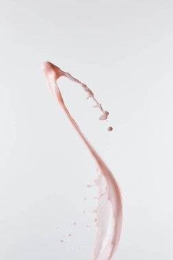 fresh pink milk splash with drops isolated on white clipart