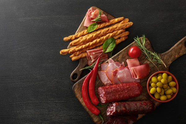 Top View Delicious Meat Platters Served Olives Breadsticks Herbs Boards — Stock Photo, Image