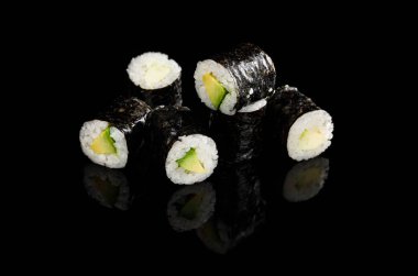 delicious sushi maki with avocado isolated on black clipart